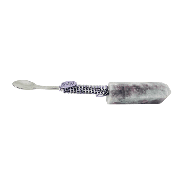 A purple and white toothbrush with a purple handle.