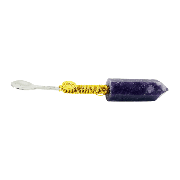 A purple and yellow pen with a white handle.