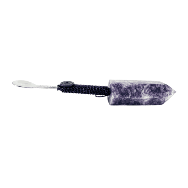 A purple and white tie dye toothbrush holder.