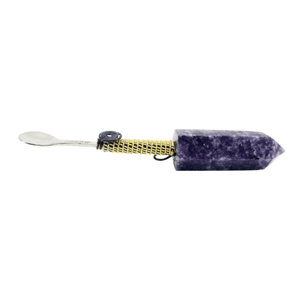 A purple stone with a measuring tape around it.