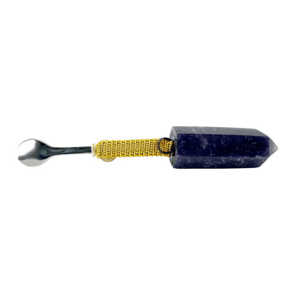 A small blue and yellow tool is on the ground