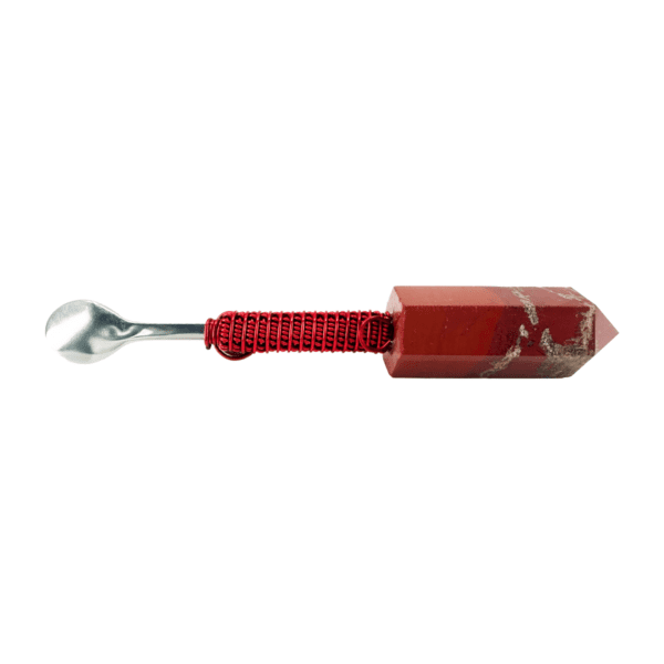 A red object with a metal handle and a string.