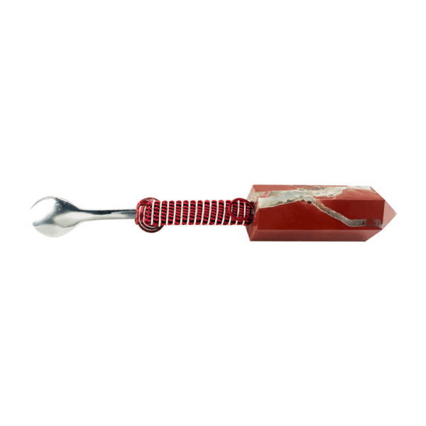 A red and white spoon with a handle