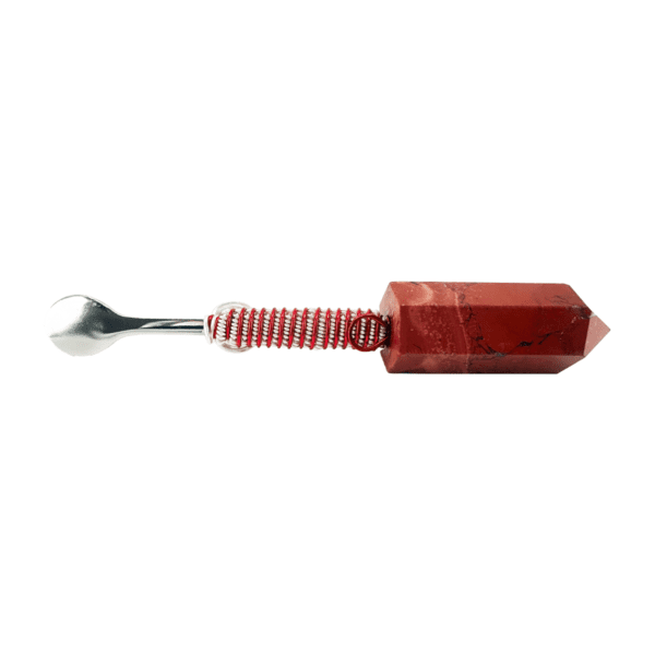 A spoon with a red handle and a metal tip.