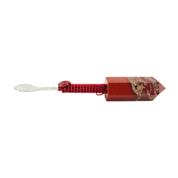 A red toothbrush with a white handle and a red cap.