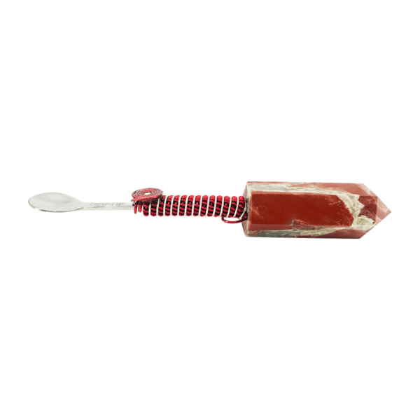 A red and white toothbrush with a striped handle.