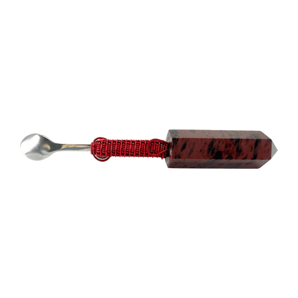 A red and black spoon with a handle