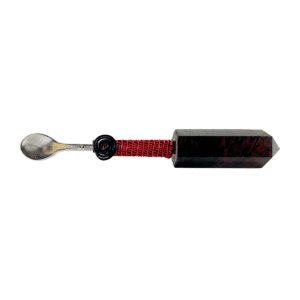 A spoon with a red string and black handle.