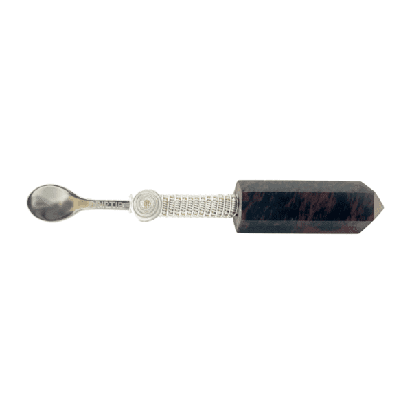 A spoon with a wooden handle and metal tip.