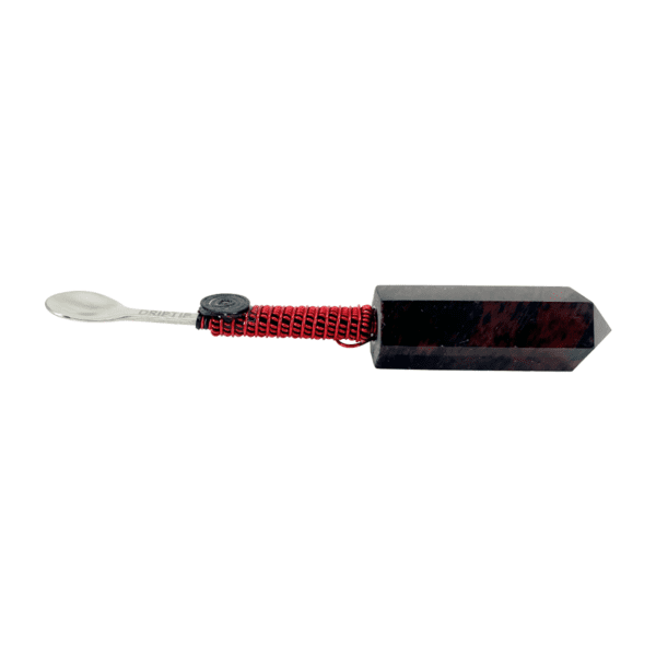 A red and black toothbrush with a white handle.