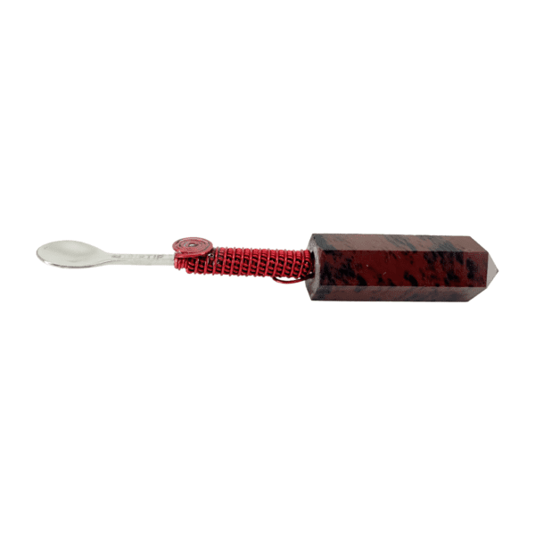 A red toothbrush with a white handle.