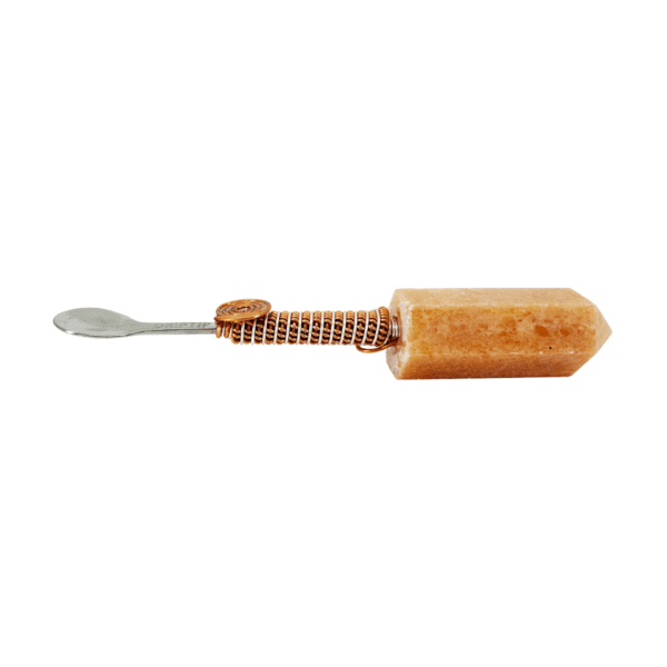 Stoneware spoon with copper wire handle.