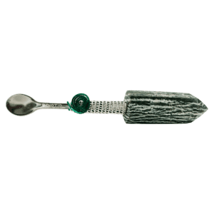 Silver spoon with green crystal handle.