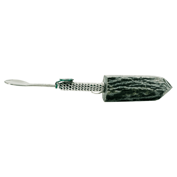 Stone and metal spoon with green accents.