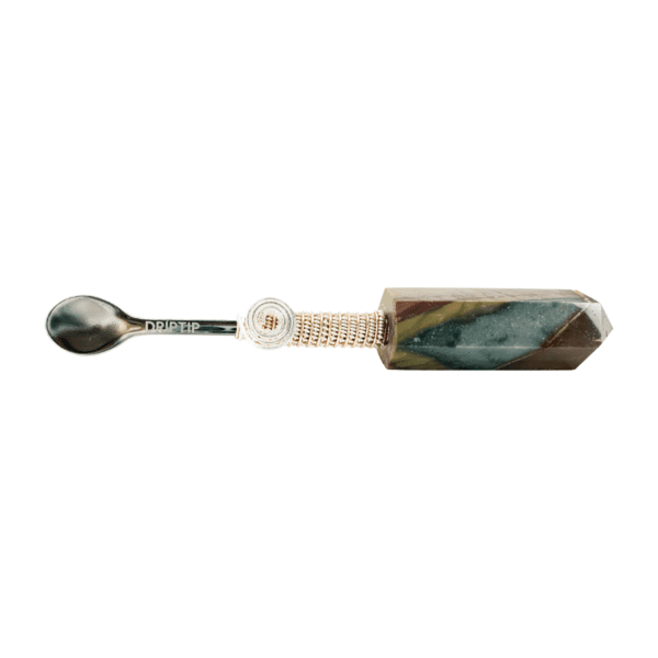 A spoon with a green and white marble handle.