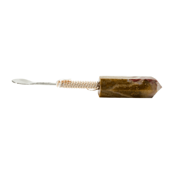 A brown and white toothbrush with a wooden handle.