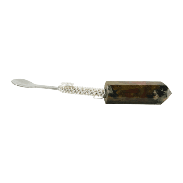 Silver spoon attached to crystal point.