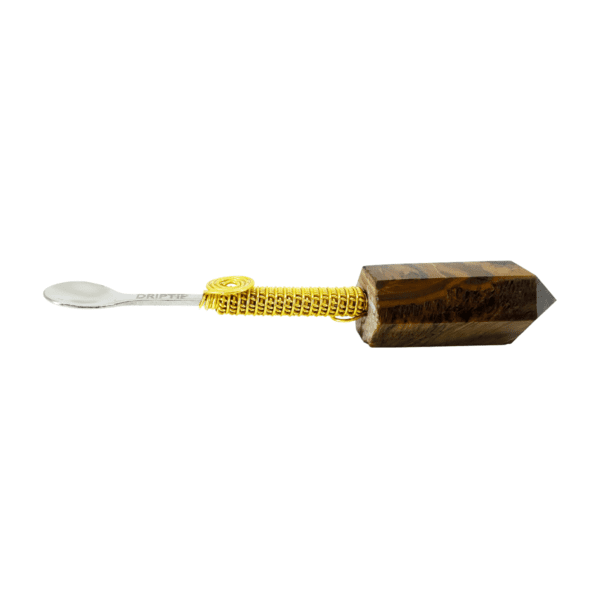 Brown and gold spoon with handle.