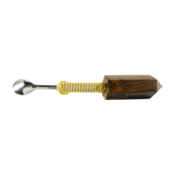 Wooden crystal with metal spoon handle.