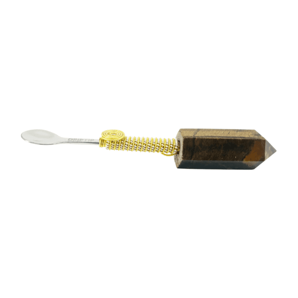 Gold-wrapped spoon with brown crystal handle.