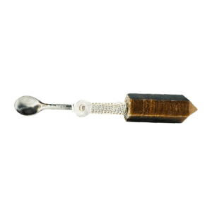 Crystal spoon with a metal handle.