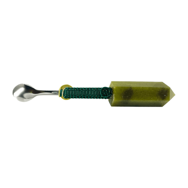 Green crystal spoon with wire wrap.