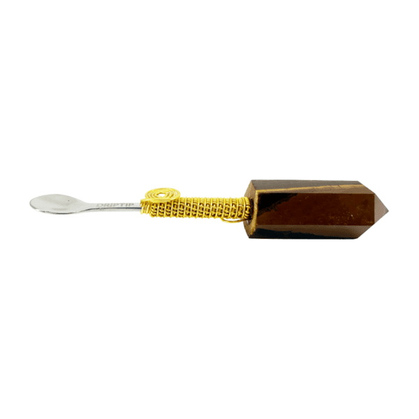 Brown crystal with gold wrapped spoon handle.