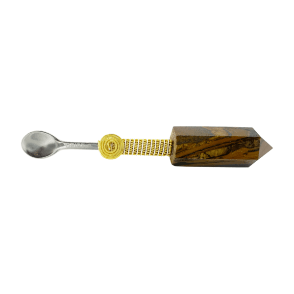 Silver spoon with a tiger eye crystal handle.