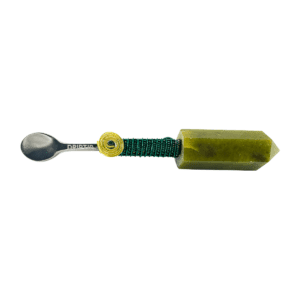 Green crystal spoon with metal handle.