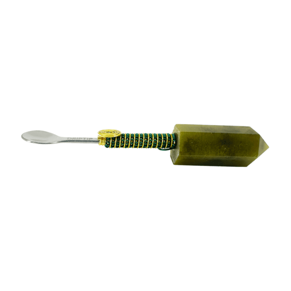 Green crystal spoon with gold accents.